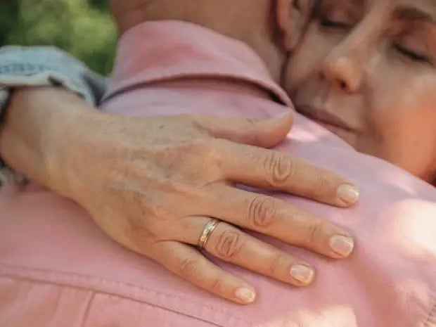 Two people embracing in a hug