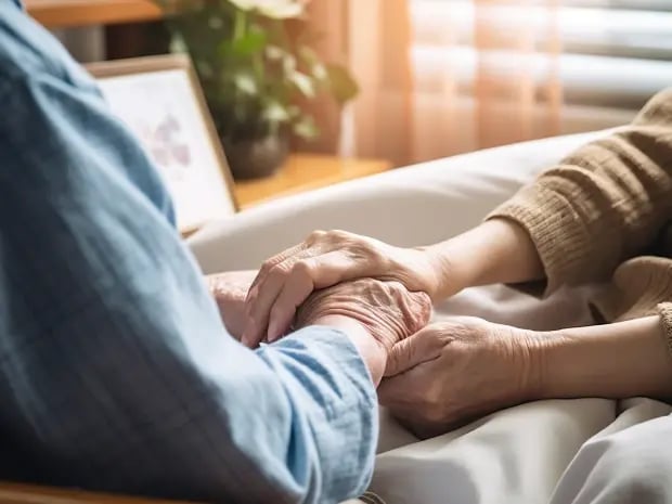 Two people holding hands